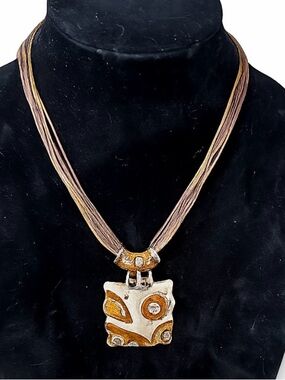 Gaudi Artisan Gold and Silver Pendant Necklace - Multistrand Brown Cord